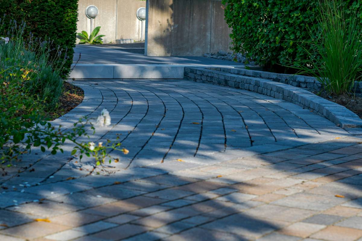 Misaligned straight garden path disrupting natural flow - example of poor garden path theory application