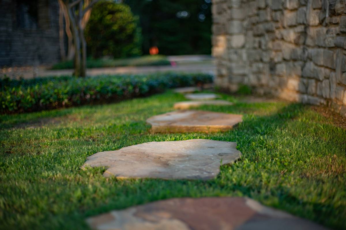 finished making a path in garden with flagstone and proper edge restraints